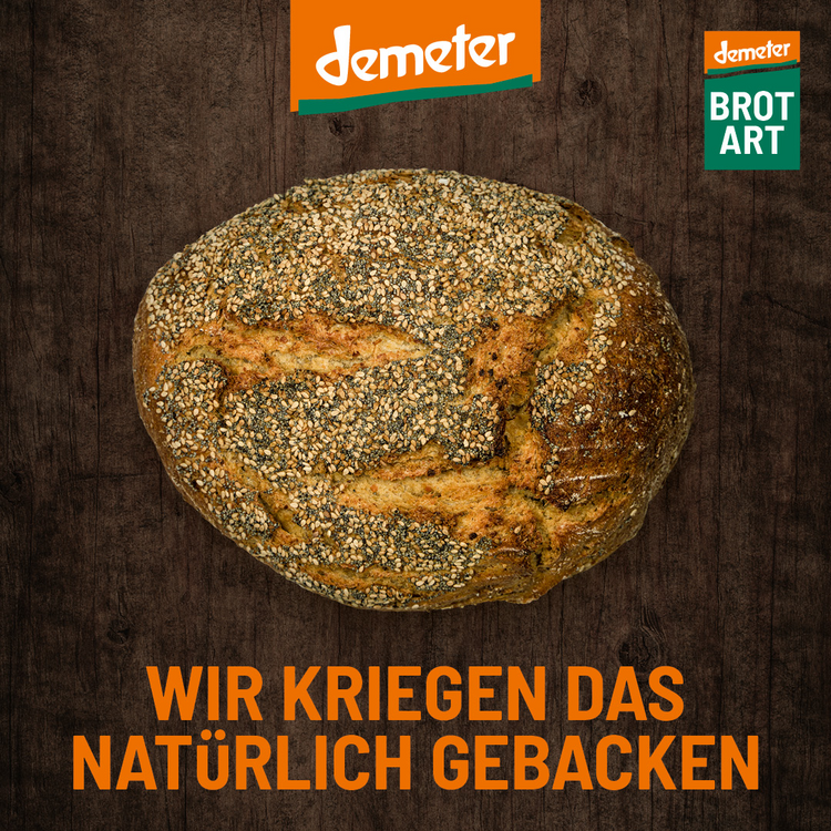 Plakat mit Brotmotiv und Text "Wir kriegen da snatürlich gebacken"
