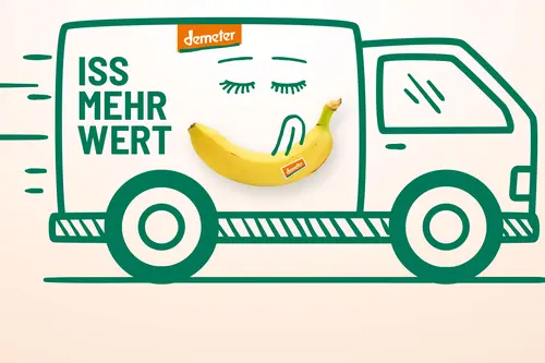 Illustration eines Lastwagens mit der Aufschrift "Iss mehr Wert" und einer lächelnden Banane